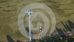 Aerial view of blue plastic pier with fishing boats. Small boats floating on the lake near the pier. Relax concept for