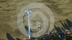 Aerial view of blue plastic pier with fishing boats. Small boats floating on the lake near the pier. Relax concept for design