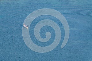 Aerial view of blue sea with fishing boat