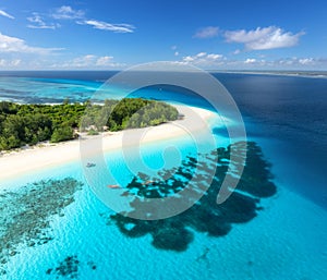 Aerial view of blue sea and Mnemba island, Zanzibar. Top view