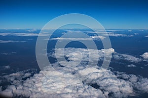 Aerial view of Blue sky and Cloud Top view from airplane window. travel and transportation concept