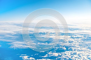 Aerial view of blue sky with layers of white clouds