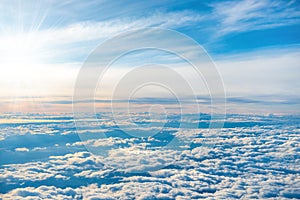 Aerial view of blue sky with layers of white clouds