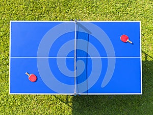 Aerial view blue table tennis or ping pong. Close-up ping-pong net. Close up ping pong net and line. Top view two table tennis or