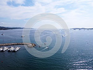 Aerial view on blue water of Gulf of Saint-Tropez and sailboats near Port Grimaud and port Cogolin, French Riviera, Provence,