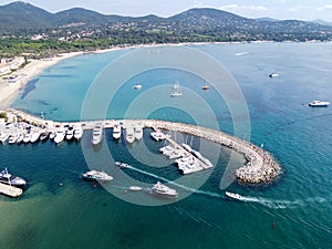 Aerial view on blue water of Gulf of Saint-Tropez and sailboats near Port Grimaud and port Cogolin, French Riviera, Provence,