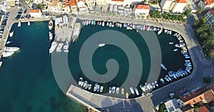 Aerial view of boat entering Supetar marina on Island of Brac, Croatia