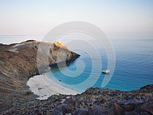 Aerial view of a boat in front of Heart Beach on a sunny day in the United Arab Emirates