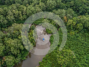 Aerial view of boat in the mangrove Rio Sierpe river in Costa Rica deep inside the jungle