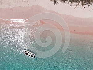 Aerial view of a boat in Pink beach in Komodo, Indonesia