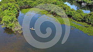 Aerial view of a boat on the Rio Cristalino river in Mato Grosso, Brazil photo