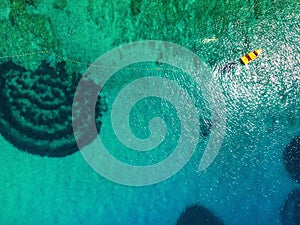 Aerial view of boat at turquoise sea.