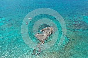 Aerial view of boats anchored off coral islet off North Bimini, Bahamas.