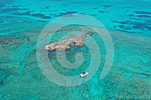 Aerial view of boats anchored off coral islet off North Bimini, Bahamas.