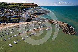 Aerial view of boats and the beach at the colorful Welsh seaside town of New Quay in Cardigan Bay