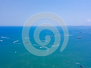 Aerial view of boats in Pattaya sea, beach with blue sky for travel background. Chonburi, Thailand