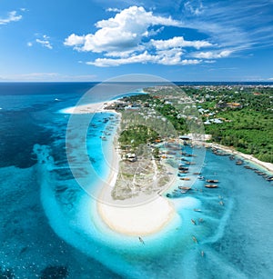 Aerial view of the boats and sea coast with white sandy beach