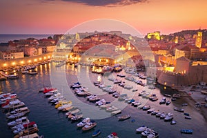 Aerial view of houses with red roofs at night in Dubrovnik