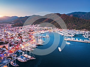 Aerial view of boats and yachts and beautiful city at sunset