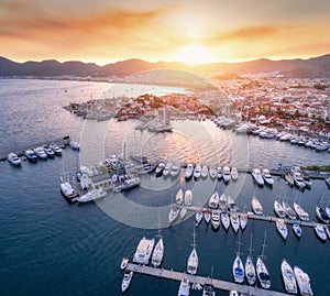 Aerial view of boats, yachts, city at sunset in Marmaris