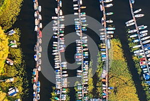 Aerial view of boats and yachts in dock at sunset in summer