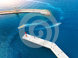 Aerial view of boats and yachts in dock at sunset in summer