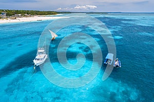 Aerial view of boats and yachts on tropical sea coast in summer