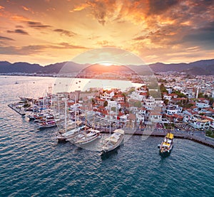 Aerial view of boats and yahts and beautiful city at sunset