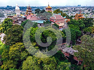 Aerial view of bodhisattva architecture and double sky dragon in Chau Thoi pagoda, Binh Duong province, Vietnam in the afternoon