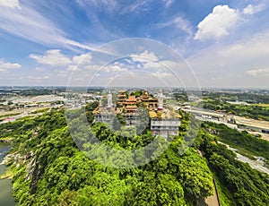Aerial view of bodhisattva architecture and double sky dragon in Chau Thoi pagoda, Binh Duong province, Vietnam in the afternoon