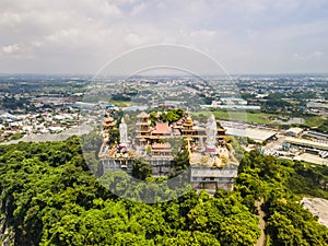 Aerial view of bodhisattva architecture and double sky dragon in Chau Thoi pagoda, Binh Duong province, Vietnam in the afternoon