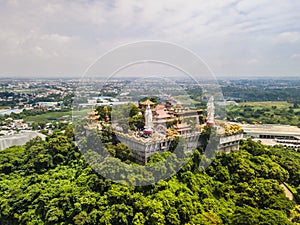 Aerial view of bodhisattva architecture and double sky dragon in Chau Thoi pagoda, Binh Duong province, Vietnam in the afternoon