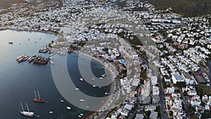 Aerial view of Bodrum Halicarnassus bay with white houses at the sunset