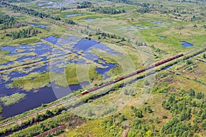 Aerial view of bog landscape and train with turf