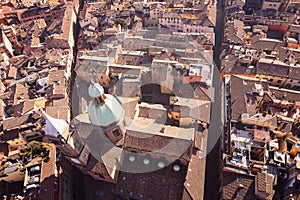 An aerial view of Bologna historic city center, highlighting the domes of the Church of Saints Bartholomew and Cajetan