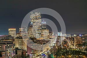 Aerial view of the Boston Back Bay skyline at night with illuminated skyscrapers