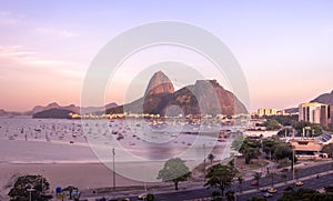 Aerial view of Botafogo, Guanabara Bay and Sugar Loaf Mountain with a pink sunset - Rio de Janeiro, Brazil