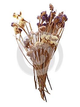 Aerial view of bouquet with wild flowers made of fabric in violeta tones. Autumn flowers close up. Artificial colorful flower photo