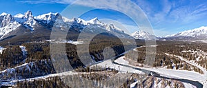 Aerial view of Bow River valley. Snowcapped Canadian Rockies mountain range panorama.