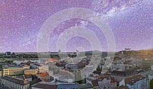 Aerial view of Bratislava from drone on a starry night above the city, Slovakia