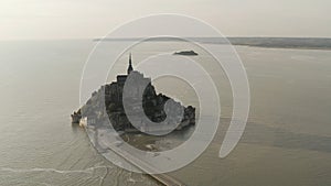 Aerial view of breathtaking Mont-Saint-Michel located, Normandy, France. Action. Top view of an amazing castle on the