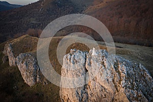 Aerial view of bride standing on a cliff