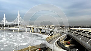 Aerial view of the bridge and higiway lanes at winter day