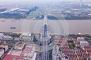 Aerial view of a bridge with Huangpu River Shanghai Downtown skyline, China. Buildings in residential area