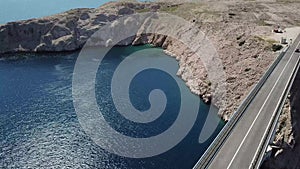 Aerial view of the bridge of the island of Pag, Croatia, road. Cliff overlooking the sea.