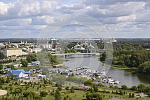 Aerial view of the bridge over the Kotorosl River, a boat dock, a park and buildings from different centuries in Yaroslavl, Russia