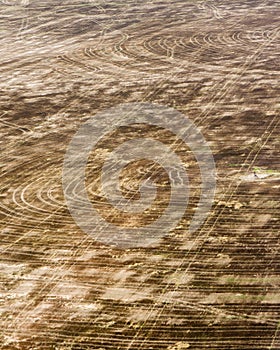 Aerial view of brown cropland recently harvested