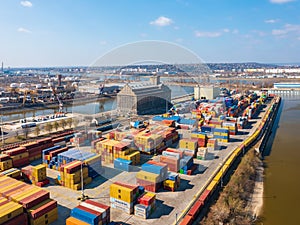 Aerial view about Budapest freeport with empty containers waiting for transport. Danube river at the background.