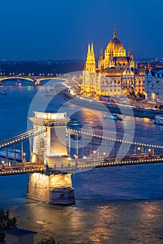 Aerial view of Budapest parliament and Chain bridge over Danube river at night Hungary