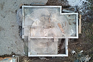 Aerial view of building works of new house concrete foundation on construction site